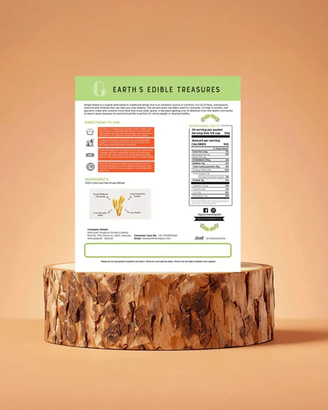 Back of khapli wheat flour pack with nutrition facts and ingredients, displayed on wooden stand
